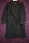 A gents 1950s wool double breasted over coat and a evening coat, around 1930s.
