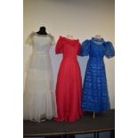 Three bright 1970s maxi dresses.