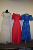 Three bright 1970s maxi dresses.