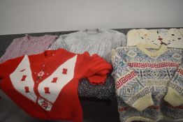 A selection of vintage and retro chunky knit ladies jumpers.