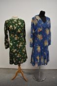 Two 1930s floral crepe day dresses having long sleeves.