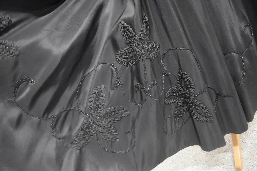 A late 1940s evening skirt having floral appliqué design and metal zip, also included in a similar - Image 7 of 7