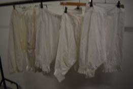 Four pairs of Victorian split leg bloomers with pretty details to the cuffs of each pair.