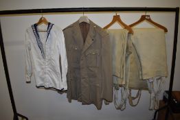 A selection of vintage uniform, including RAF Firefighters wool trousers, a sailors tunic and a