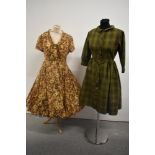 A 1960s patterned silk dress with cowl neck and a late 1950s cotton dress with geometric pattern,