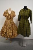 A 1960s patterned silk dress with cowl neck and a late 1950s cotton dress with geometric pattern,