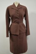 A fitted 1940s ladies suit in textured taupe wool.