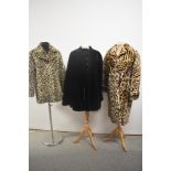 Two vintage faux fur coats and a cape.