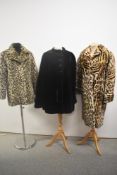 Two vintage faux fur coats and a cape.