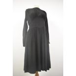 A 1930s semi sheer black day dress having full length sleeves, gathered bust, press stud fastening