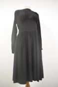 A 1930s semi sheer black day dress having full length sleeves, gathered bust, press stud fastening