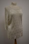 An Art deco knitted top having three quarter length sleeves and castellated hem.