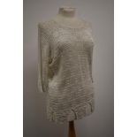 An Art deco knitted top having three quarter length sleeves and castellated hem.