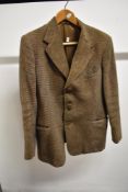 A vintage 1940s Harris Tweed jacket having Burton label, Pockets to sides and one to breast.