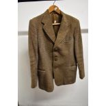 A vintage 1940s Harris Tweed jacket having Burton label, Pockets to sides and one to breast.