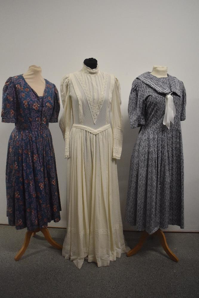 Three vintage Laura Ashley dresses including blue floral with sailor collar.