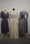Three vintage Laura Ashley dresses including blue floral with sailor collar.