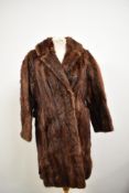 A 1950s/60s chestnut mink coat having half belt to back having Glasgow label to nape.