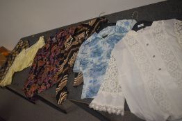 Six ladies vintage tops and blouses in vibrant patterns, various sizes and styles.