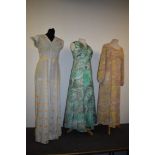 Three vibrant 1960s maxi dresses.