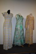 Three vibrant 1960s maxi dresses.
