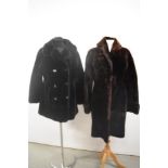 A vintage sheepskin coat in brown and a similar faux fur coat in black.
