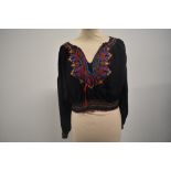A vintage navy blue Hungarian embroidered peasant blouse.
