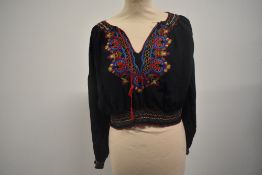 A vintage navy blue Hungarian embroidered peasant blouse.