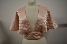 An opulent quilted Art Deco bead jacket in pale pink satin.
