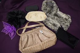 A collection of vintage bags and purses, fascinators and a 1930s/40s grey tippet.