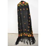 A beautiful late 19th/ early 20th century shawl having black ground with orange, red and yellow