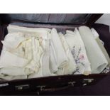 A suitcase containing mixed table linen, including embroidered examples, also included is a gents