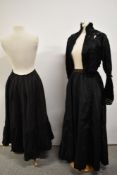 A Victorian black silk bodice having extensive ladder work detailing, a petticoat and skirt also