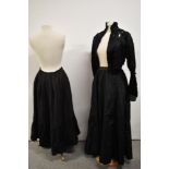 A Victorian black silk bodice having extensive ladder work detailing, a petticoat and skirt also
