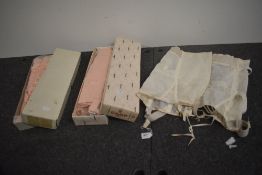 Two vintage girdles in original packaging and boxes and another without box but showing very