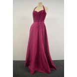 A 1940s halter neck evening gown in cerise pink having back metal zip and Soutache braiding to