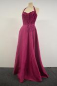 A 1940s halter neck evening gown in cerise pink having back metal zip and Soutache braiding to