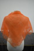 A vintage 1960s hand frame knitted orange mohair scarf.