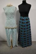 A 1960s two piece set comprising of crochet mini dress with matching trousers in pale blue and a