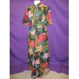 A 1960s/early 70s Quad maxi dress having vibrant floral pattern.