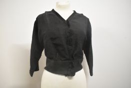 A Victorian bodice of textured grosgrain fabric, with unusual detailing to front and 3/4 sleeves,