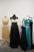 Five 1970s and 1980s evening gowns including black and cream John Charles dress.