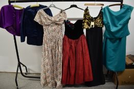 A collection of 1980s dresses and clothing, including Laura Ashley style floral dress and 'La
