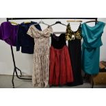 A collection of 1980s dresses and clothing, including Laura Ashley style floral dress and 'La