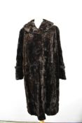 A full length vintage mole skin coat having turn up cuffs and shawl collar, around 1940s.