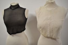 A Victorian black georgette modesty panel or bib front with stand up collar and similar Edwardian