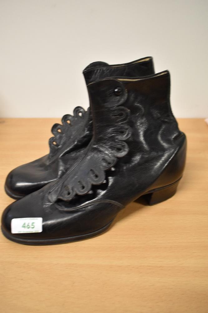 A pair of Edwardian black leather button fastening ankle boots.