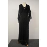 A 1930s black lace bias cut evening gown with silk lining and bolero.