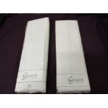 Two Givans Irish linen stores king size sheets in packaging.