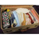 A suitcase full of mixed vintage and retro fabrics.